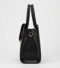 Side profile of black structured satchel bag showing top handles