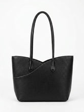 Black pebbled leather shopper tote bag, front view with long handles