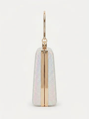 Side profile of glitter box clutch showing slim gold frame