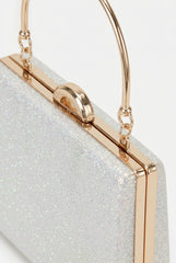 Close-up of glitter box clutch showing gold clasp and handle detail