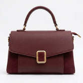 Burgundy suede and leather top handle flap bag, front view with gold buckle