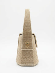 Side profile of gold rhinestone mini bag