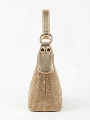 Side profile of gold rhinestone shoulder bag