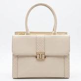 Cream structured satchel bag with gold T-bar clasp, front view