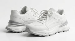 Pair of white chunky runner sneakers shown at an angle