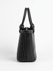 Side profile of black chevron quilted tote