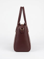 Side profile of burgundy structured satchel