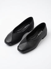 Pair of black square toe ballet flats