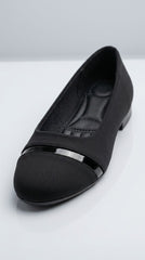Close-up of the patent toe cap and bar on a black ballet flat