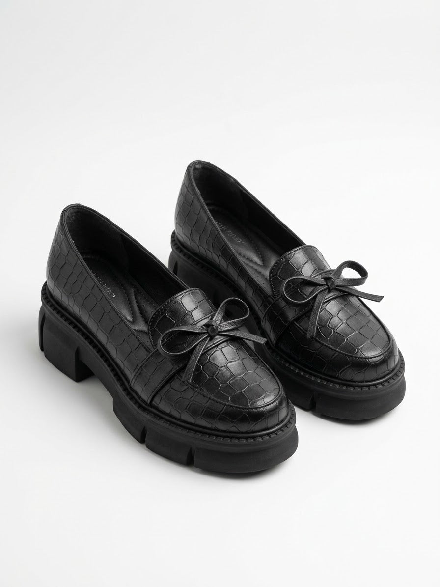 Black croc-embossed chunky lug sole bow loafers, pair