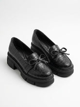 Black croc-embossed chunky lug sole bow loafers, pair