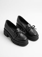 Black croc-embossed chunky lug sole bow loafers, pair