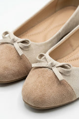 Close-up of the suede bow and padded insole, cream and tan