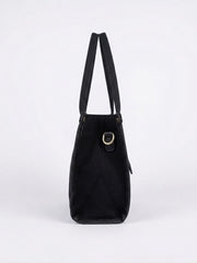 Side profile of black canvas tote bag