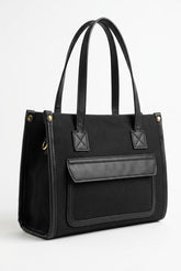 Black canvas tote with front flap pocket, front view