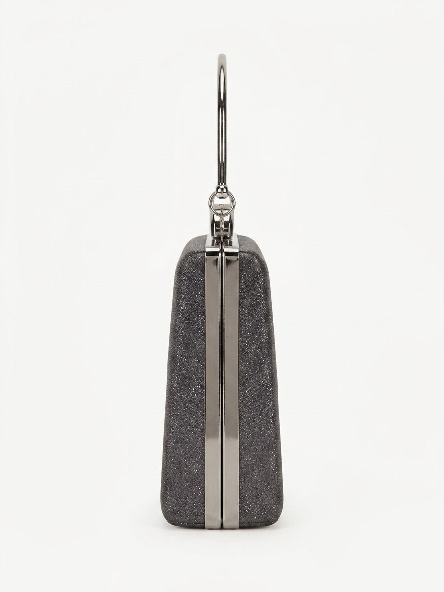 Side profile of black glitter box clutch with silver frame