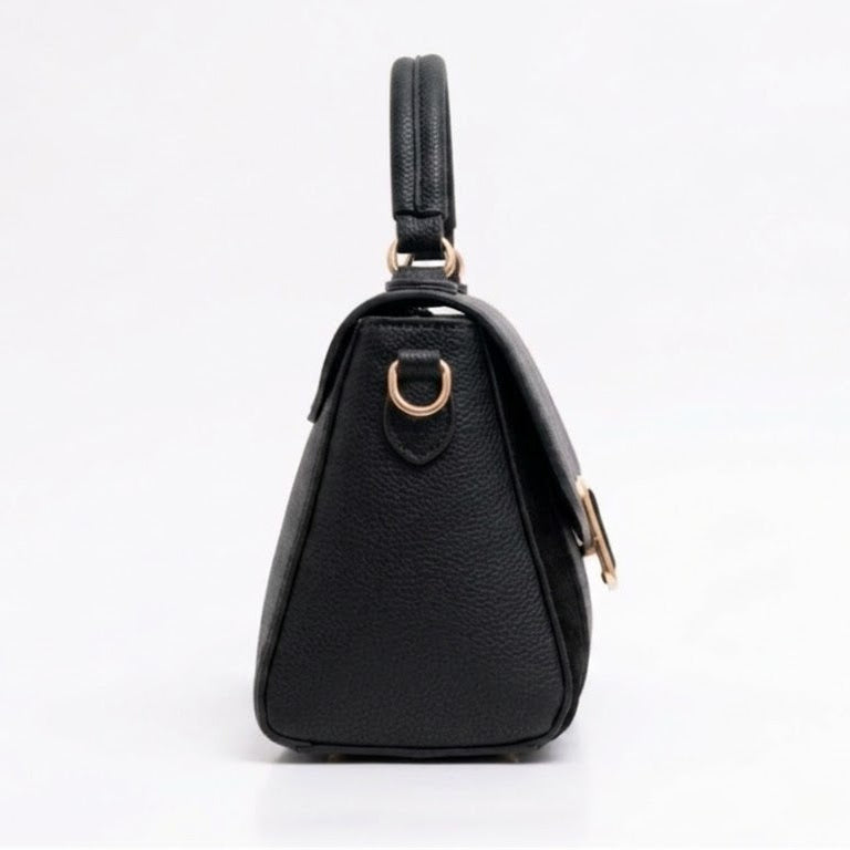 Side profile of black top handle flap bag