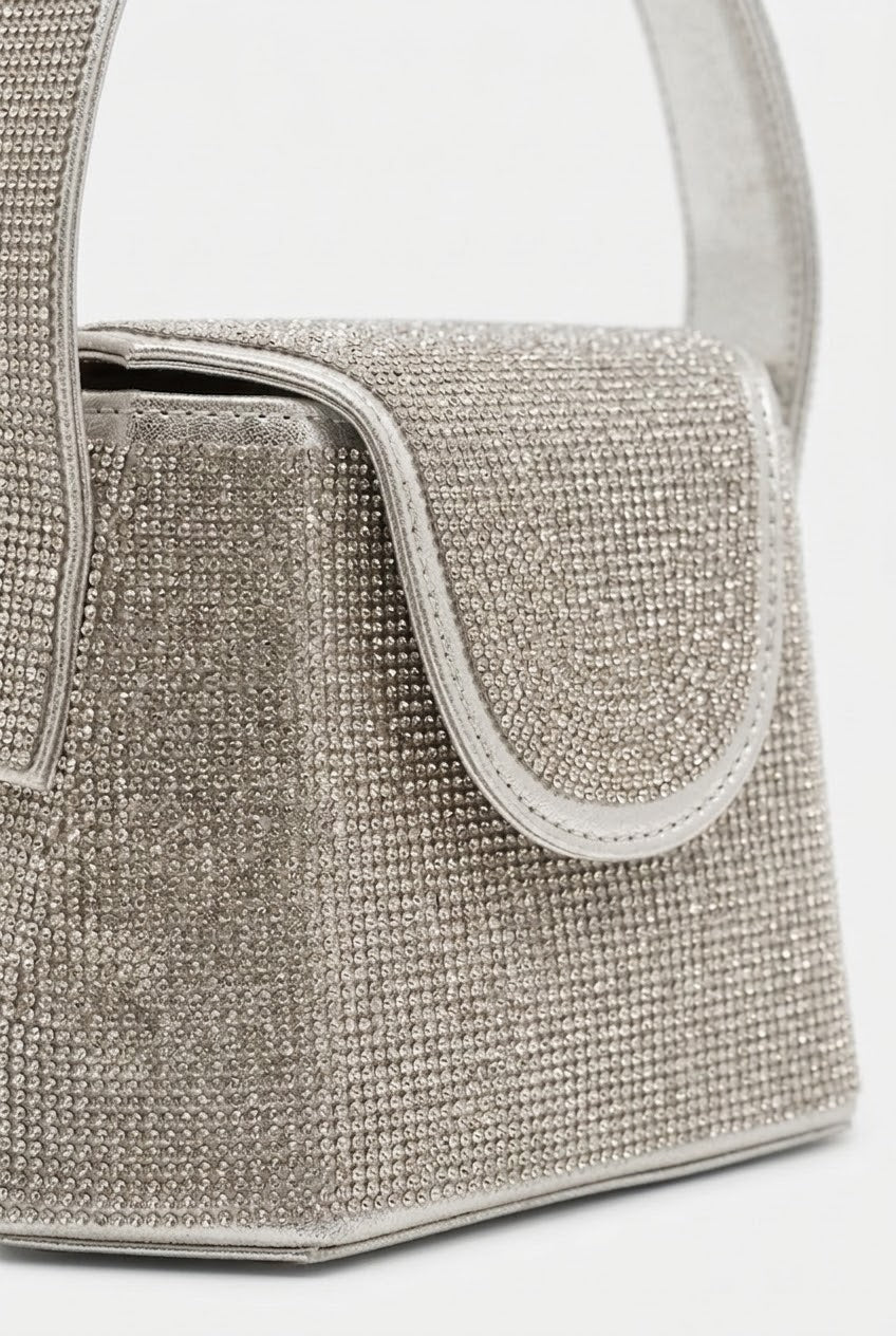 Close-up of silver rhinestone bag showing crystal texture
