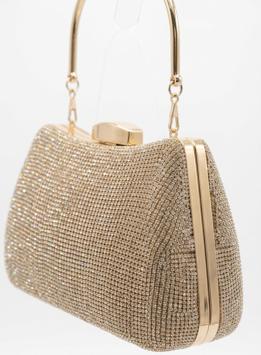 Angled view of gold rhinestone frame clutch showing metal frame