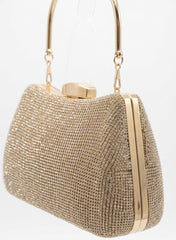Angled view of gold rhinestone frame clutch showing metal frame