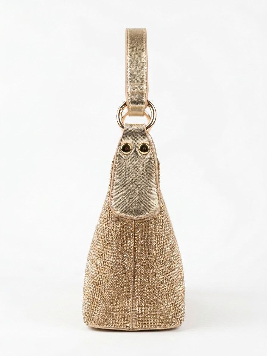 Side profile of gold rhinestone shoulder bag