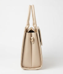 Side profile of cream structured satchel bag