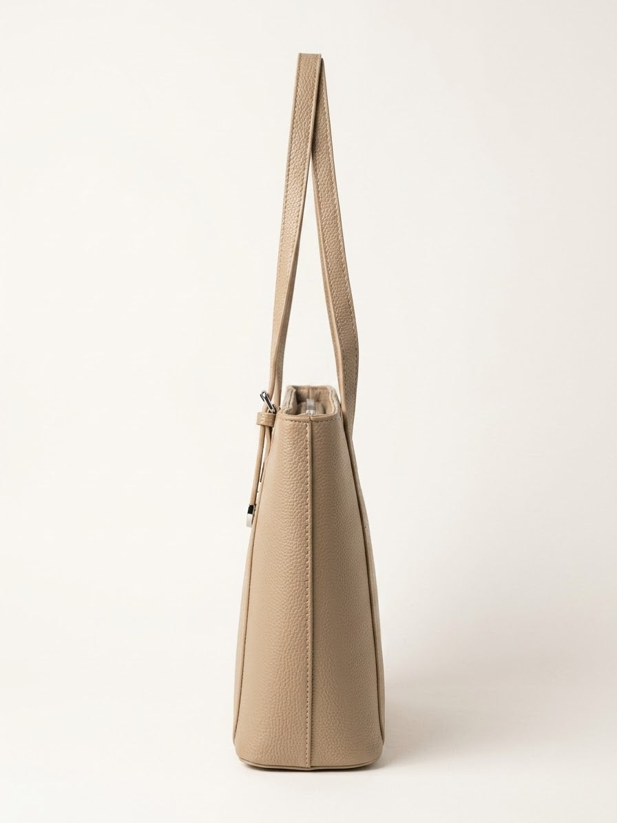 Side profile of taupe structured shoulder tote