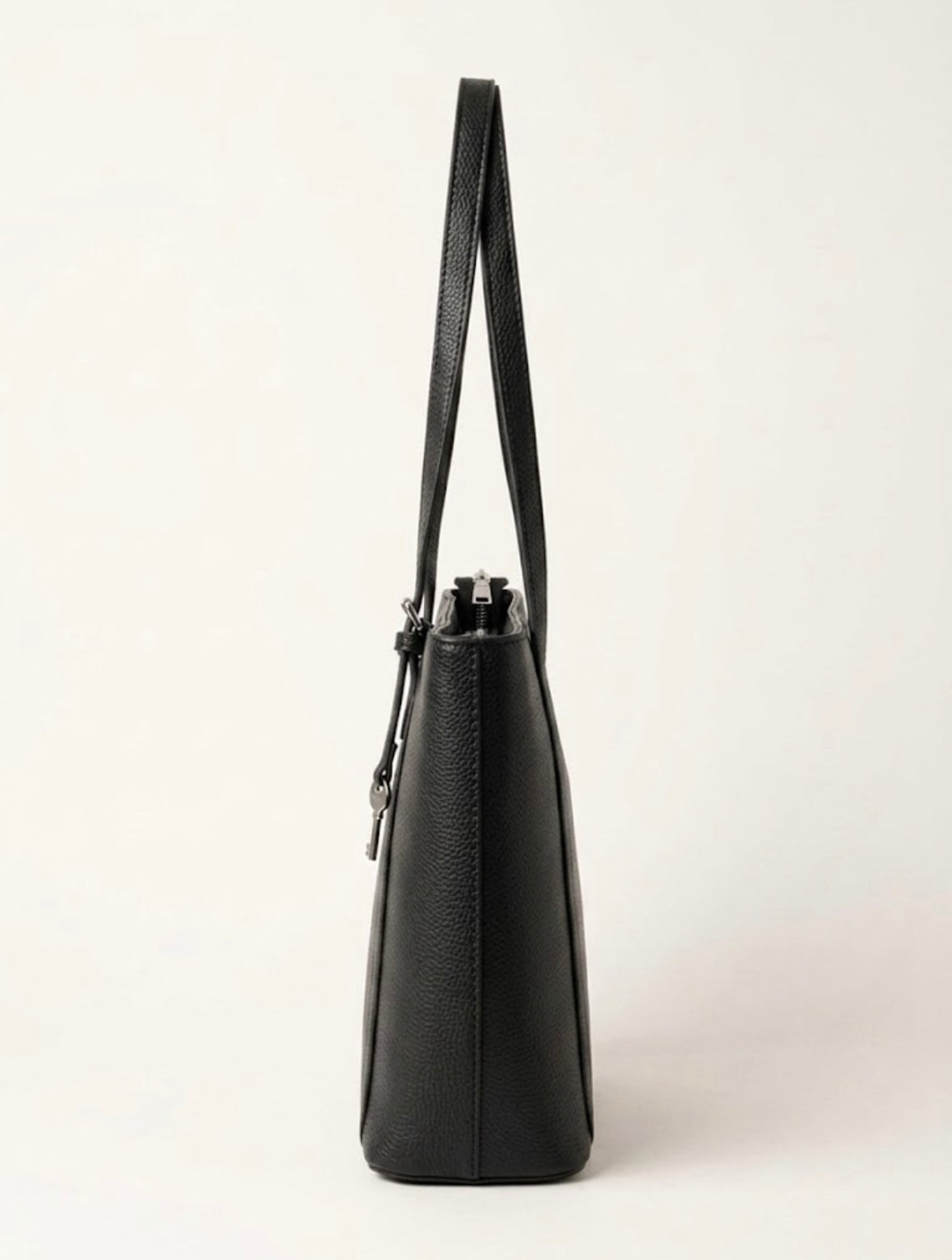 Side profile of black structured shoulder tote
