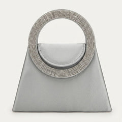 Silver satin trapeze evening bag with crystal ring handle, front view