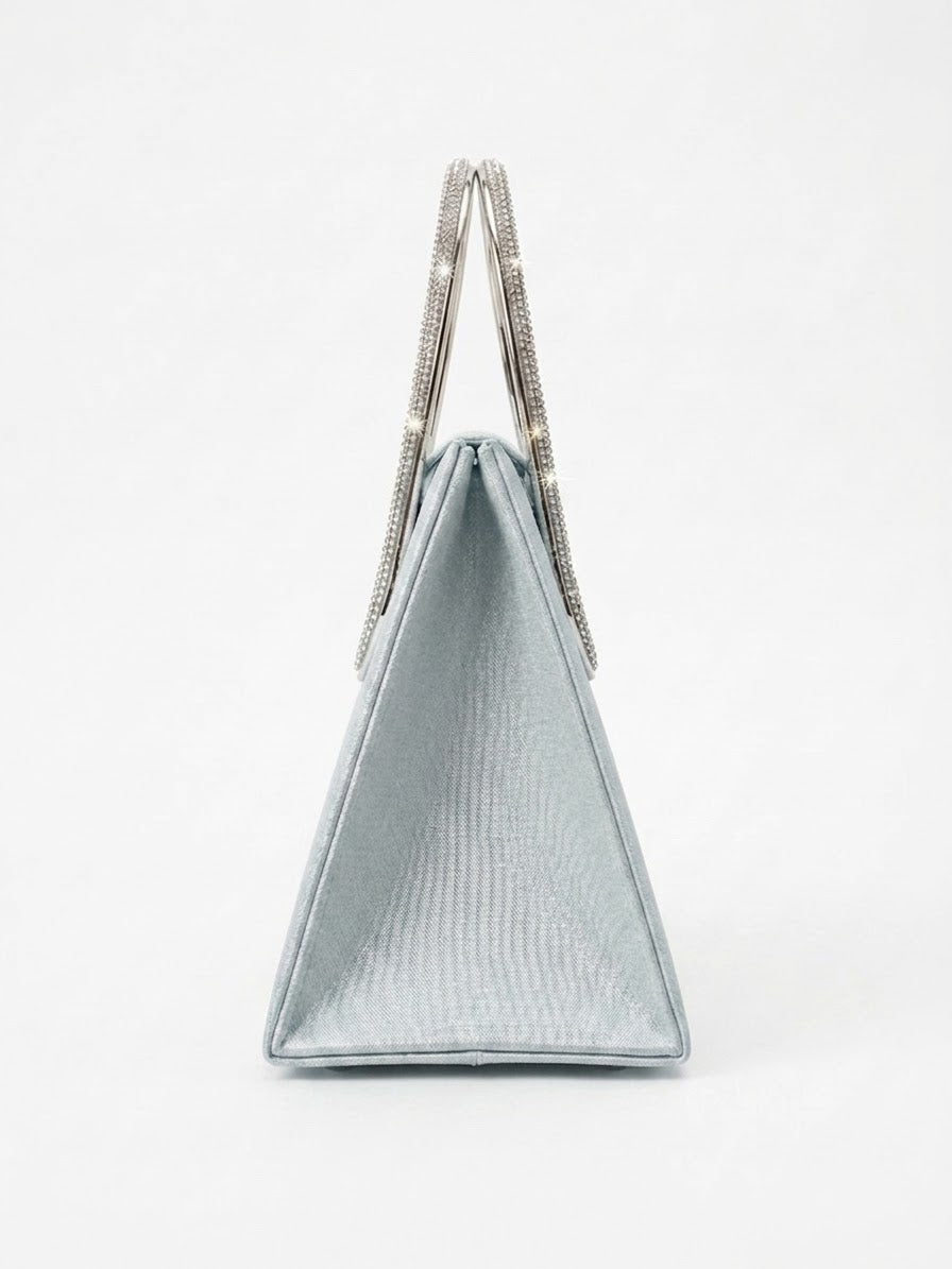 Side profile of silver satin trapeze bag