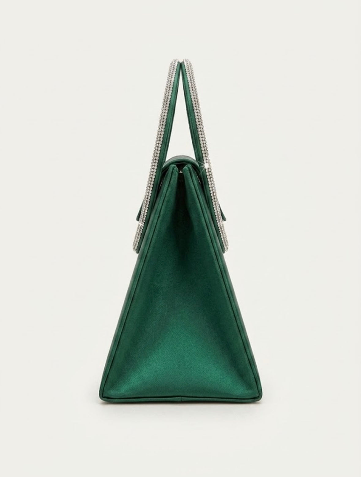 Side profile of emerald green satin trapeze bag