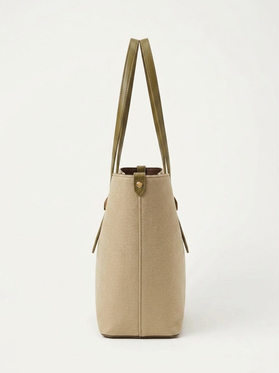 Side profile of beige textured shopper tote