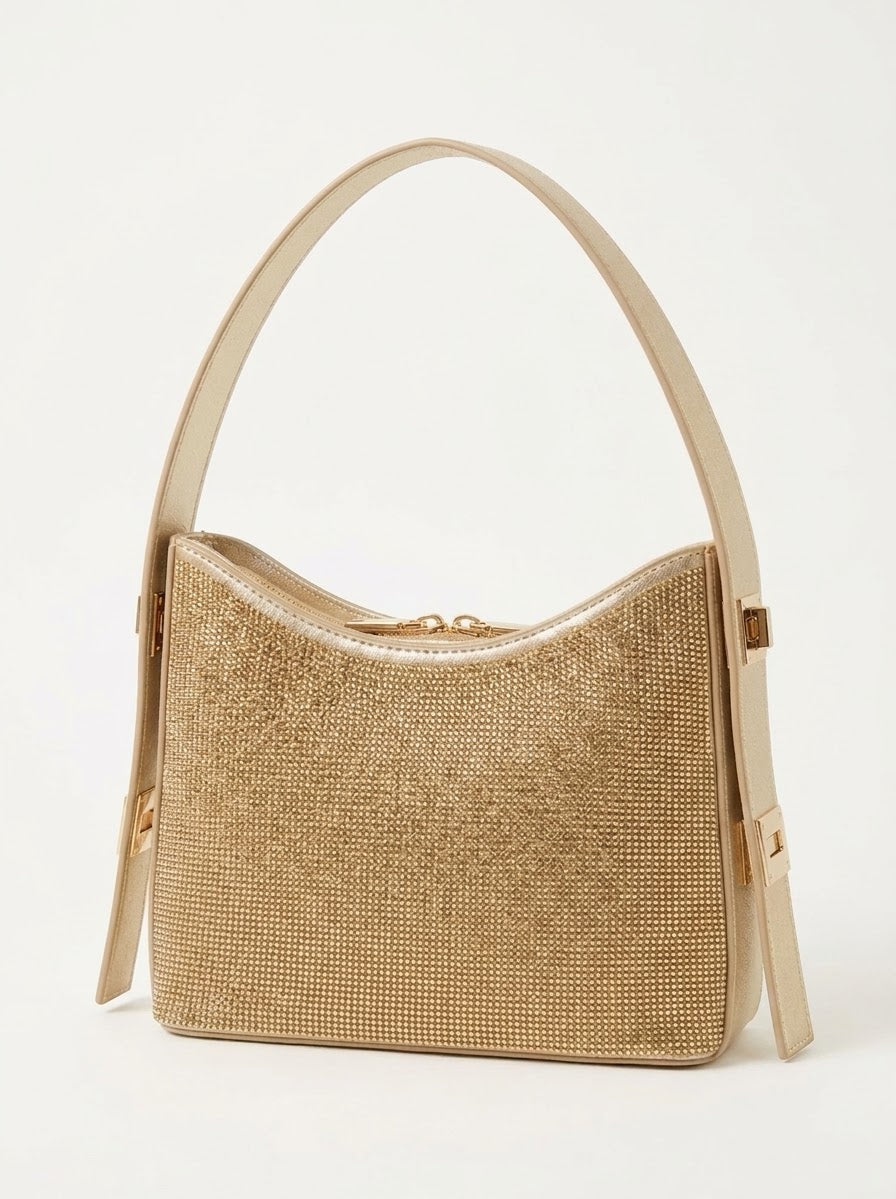 Angled view of gold rhinestone shoulder bag showing crystal texture