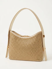 Angled view of gold rhinestone shoulder bag showing crystal texture