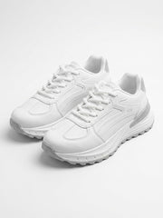 Pair of white runner sneakers viewed from above