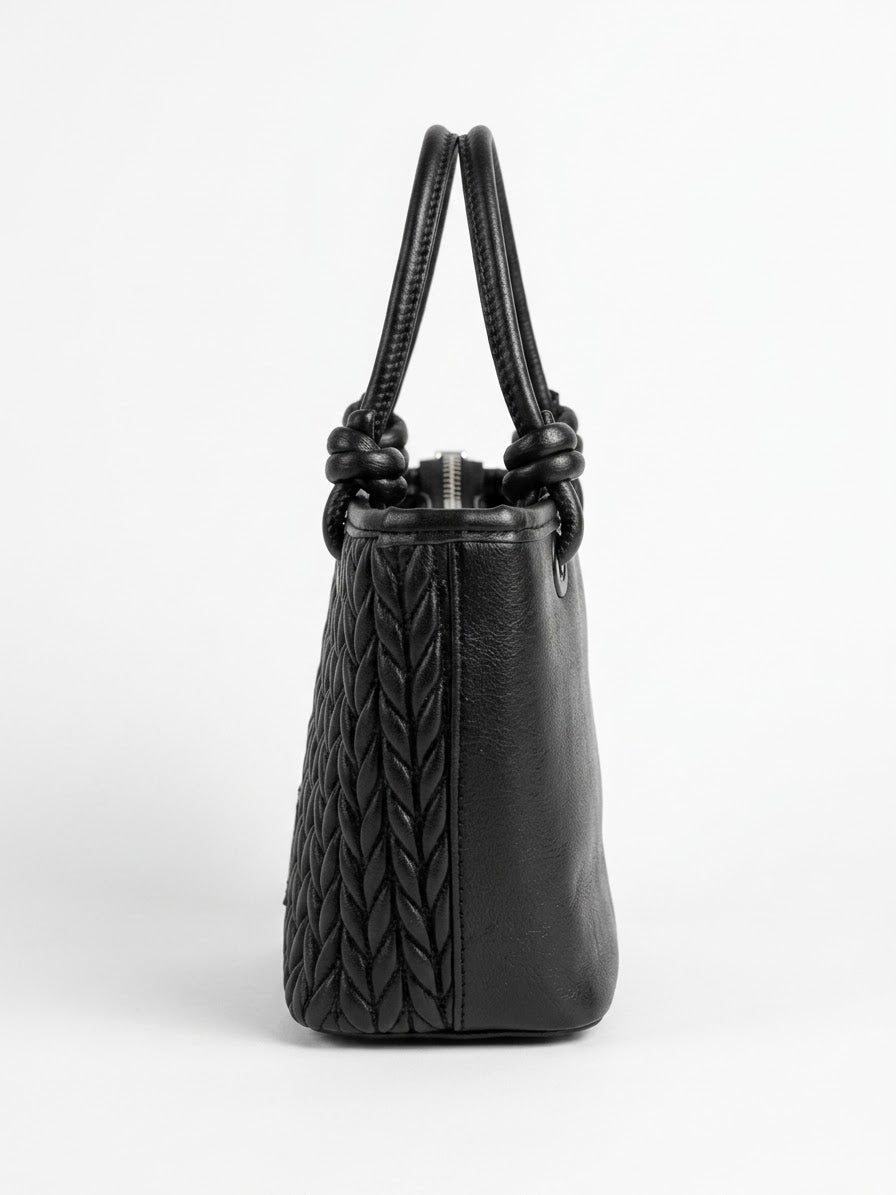 Side profile of black chevron quilted tote