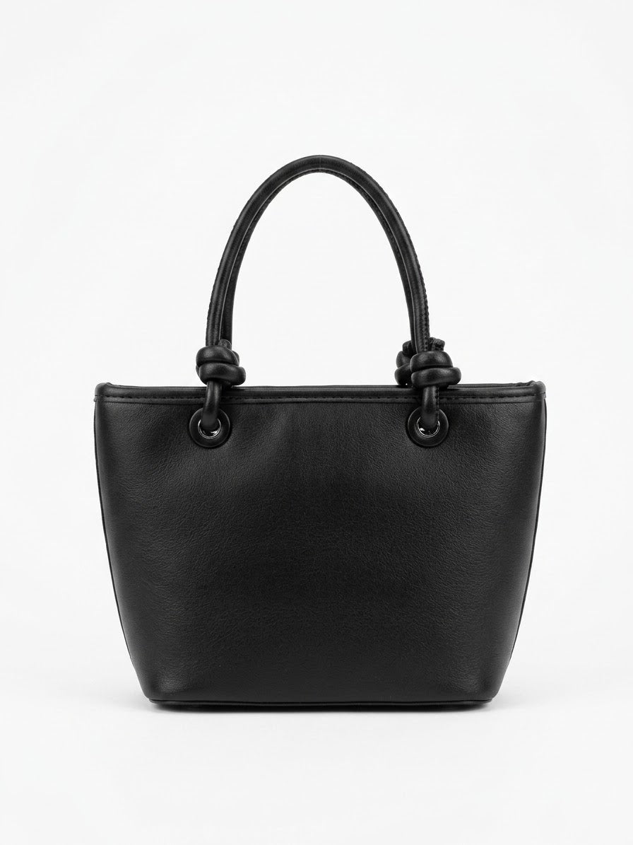 Back view of black quilted tote with knotted handles