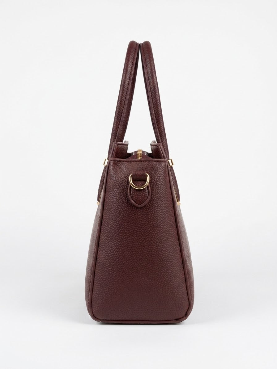 Side profile of burgundy structured satchel
