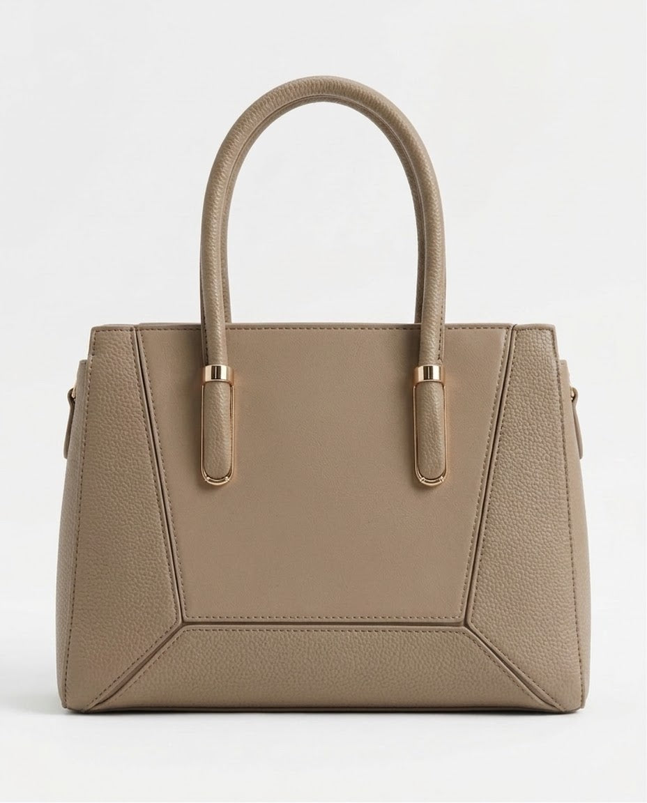 Taupe structured satchel bag with gold handle bars, front view