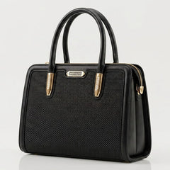 Black woven frame handbag shown from the side angle