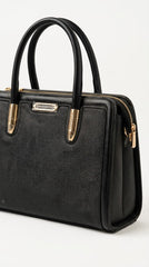 Angled view of black woven frame handbag showing texture