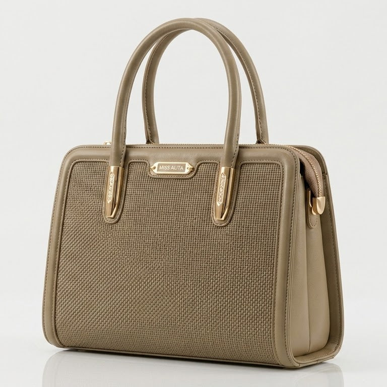Angled view of taupe woven frame handbag showing texture
