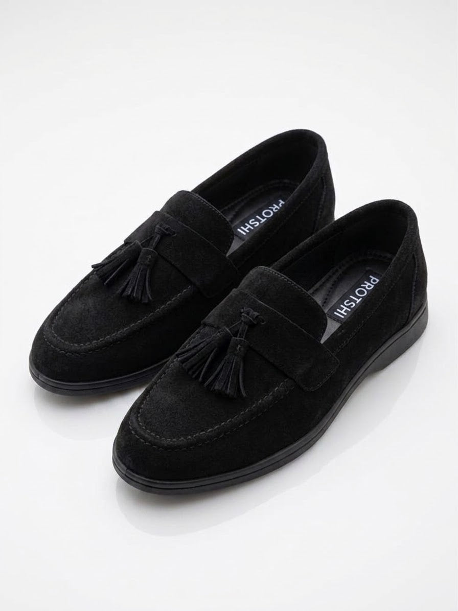 Pair of black suede tassel loafers