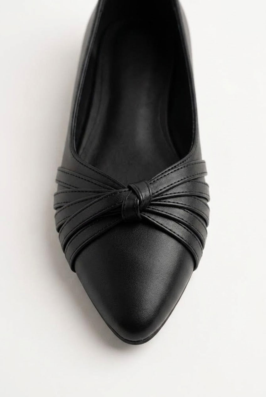 Close-up of black flat showing gathered knot detail