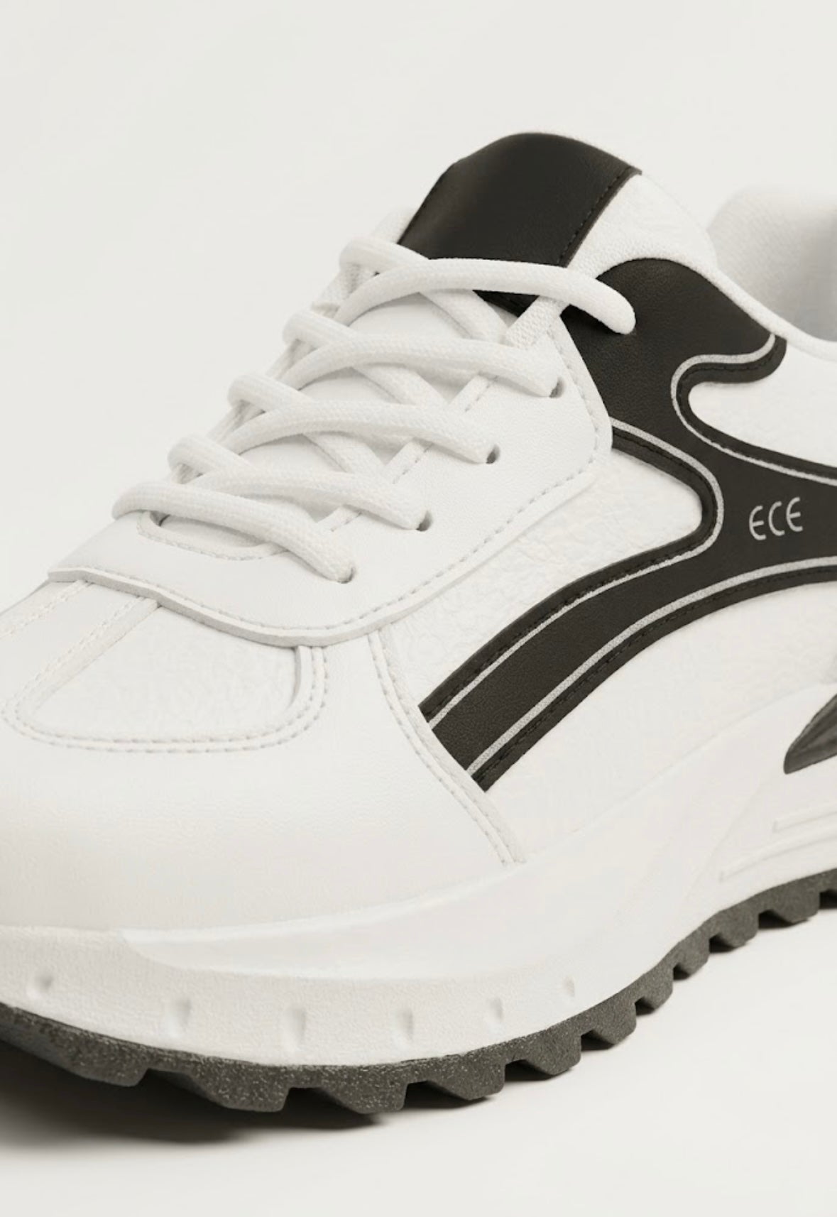 Close-up of black and white runner sneaker upper