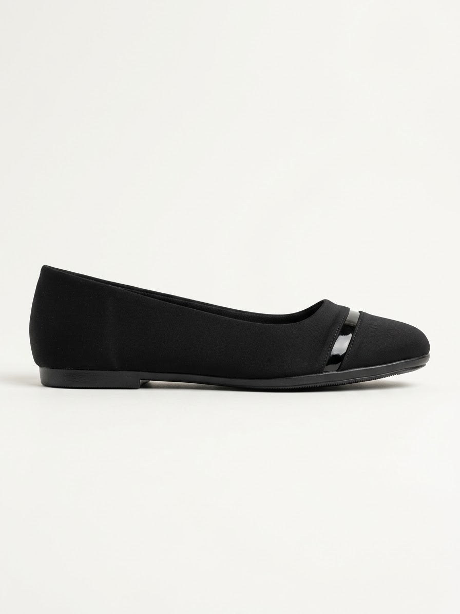 Black pointed ballet flat with a patent toe bar, side view