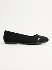 Black pointed ballet flat with a patent toe bar, side view