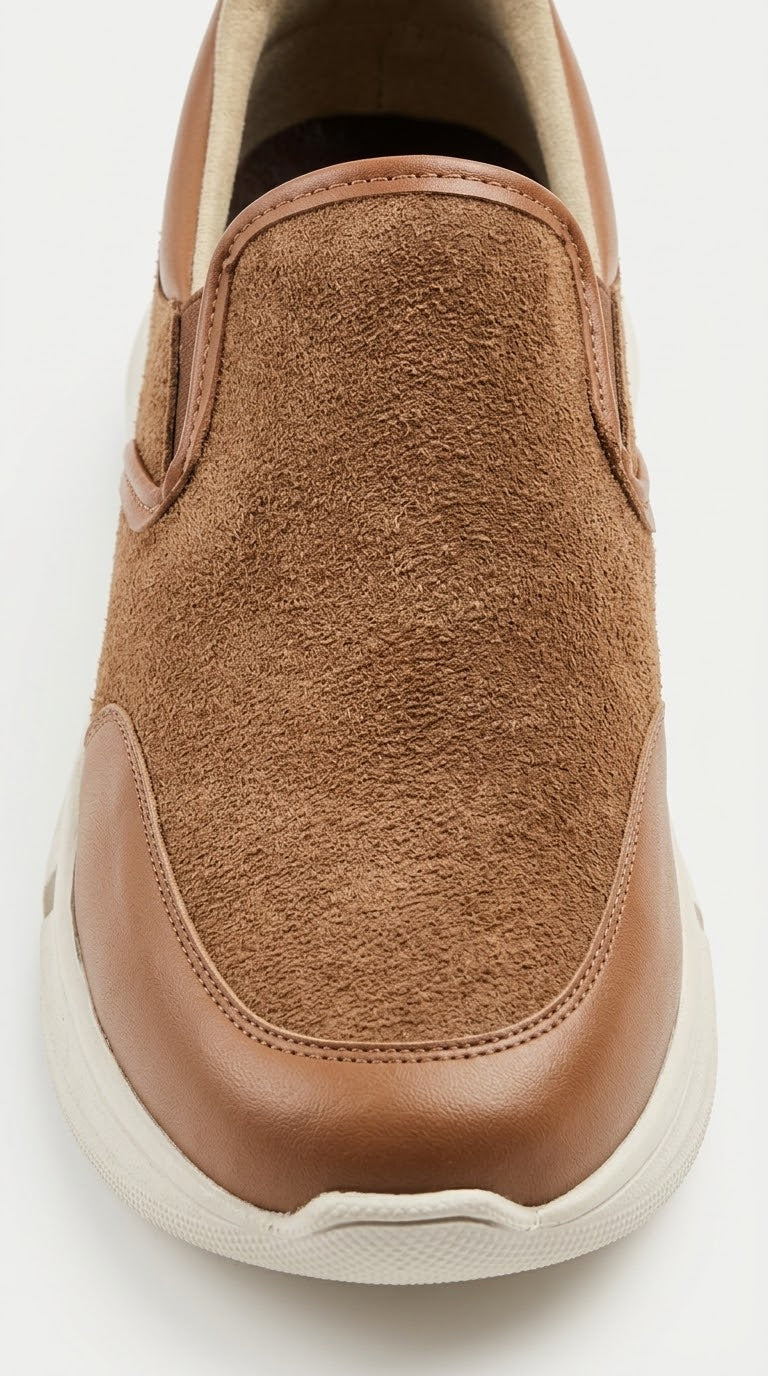 Close-up of the toe and sole on a tan suede slip-on sneaker