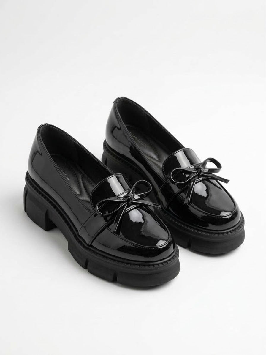 Black patent chunky lug sole bow loafers, pair