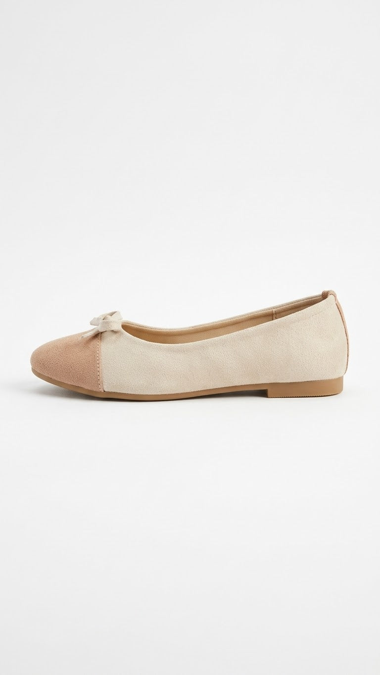Cream suede ballet flat with tan cap toe, side view